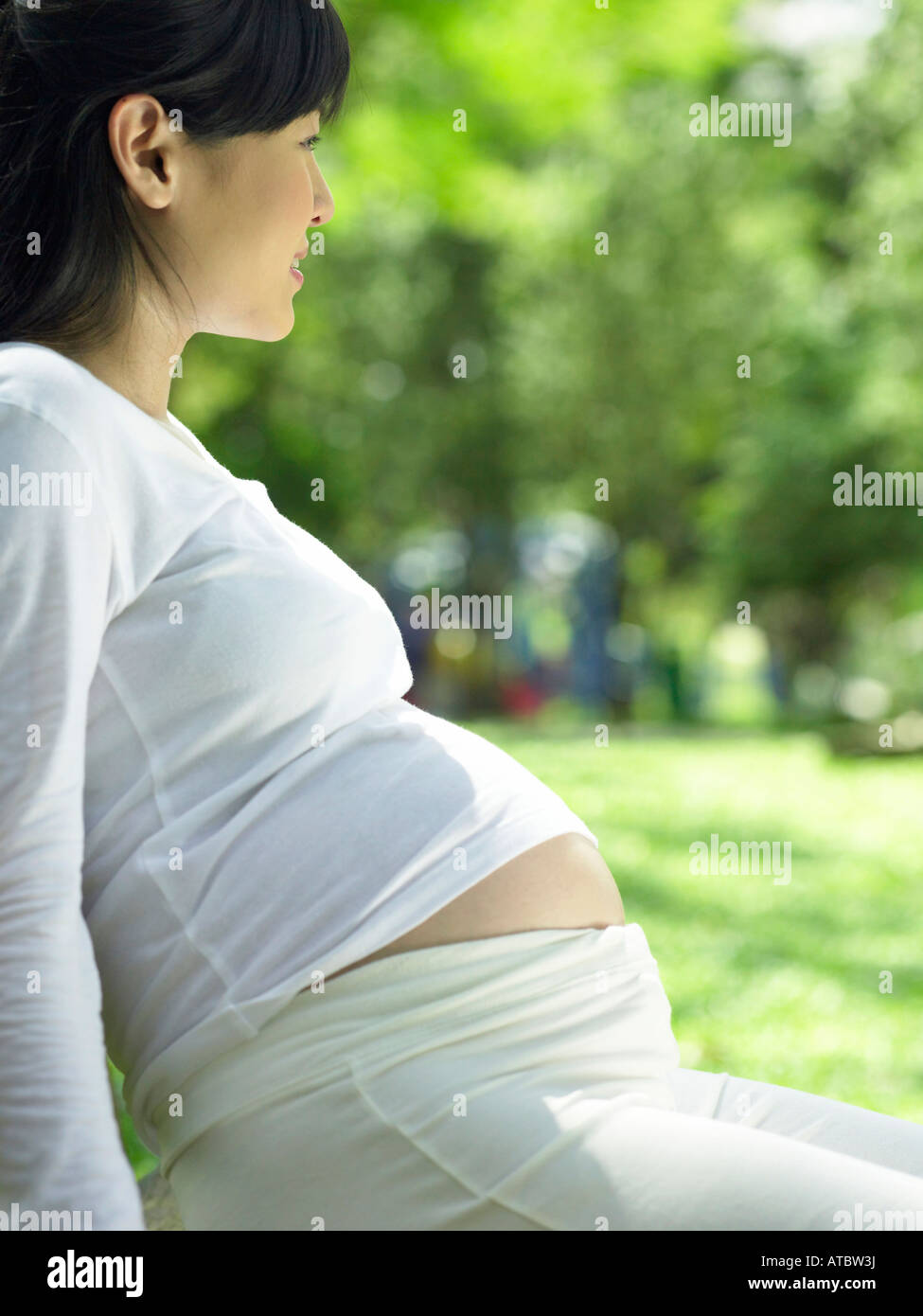 pregnant woman in the park Stock Photo - Alamy