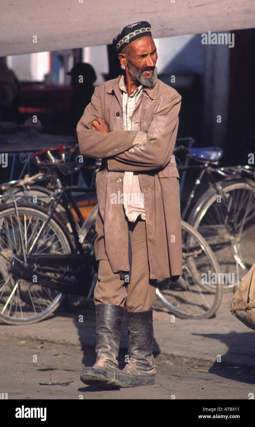 Uyghur man in traditional outfit. Kasghar, Xingjiang, China Stock Photo ...
