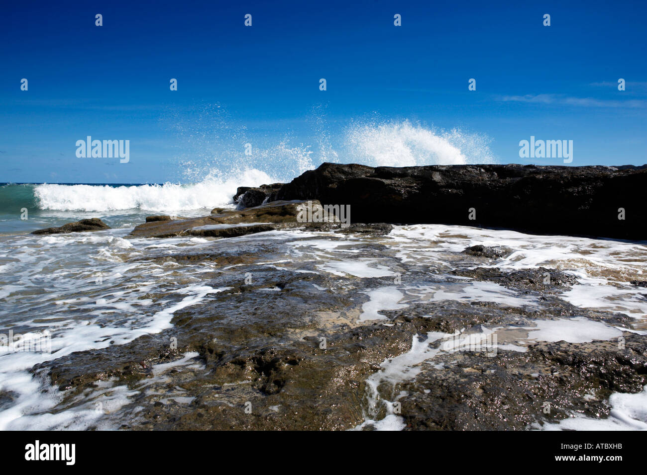Small waves crashing on rocks hi-res stock photography and images - Alamy