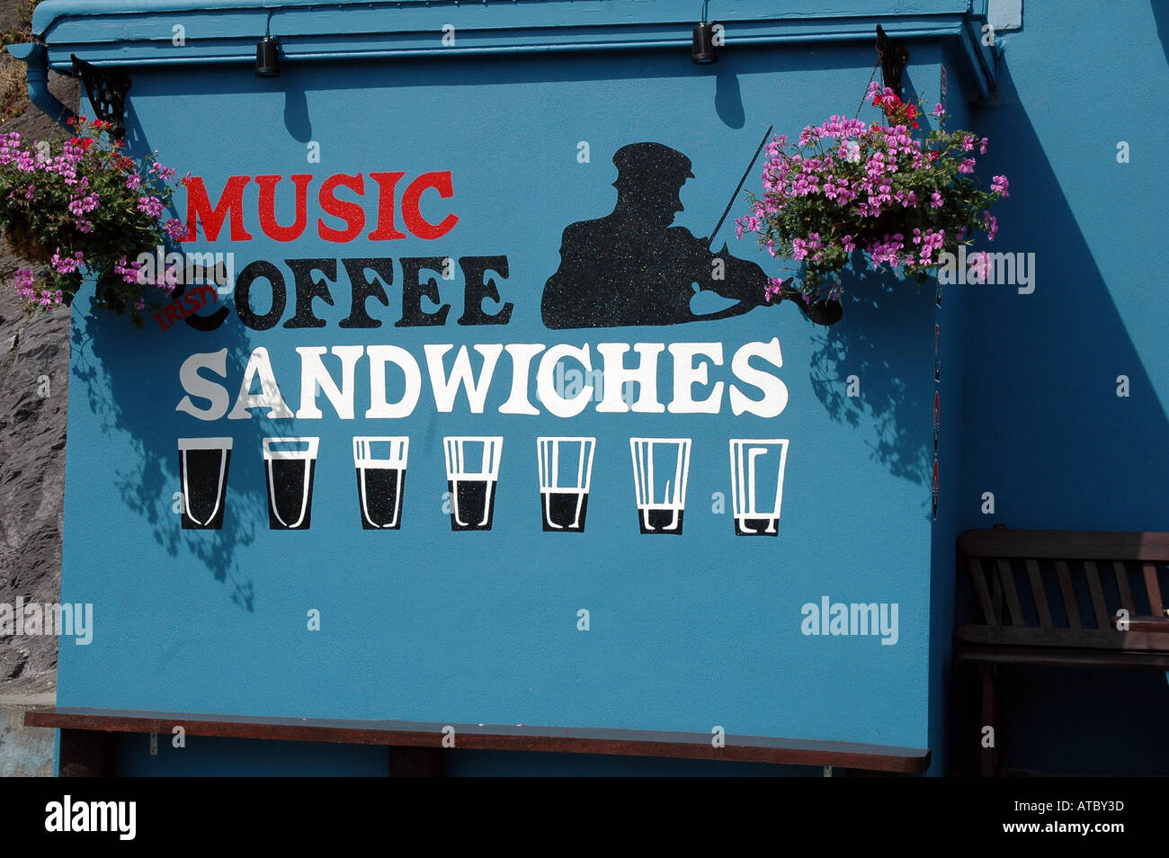 A striking pub sign i featuring Music Coffee & Sandwiches in co Kerry Ireland Stock Photo