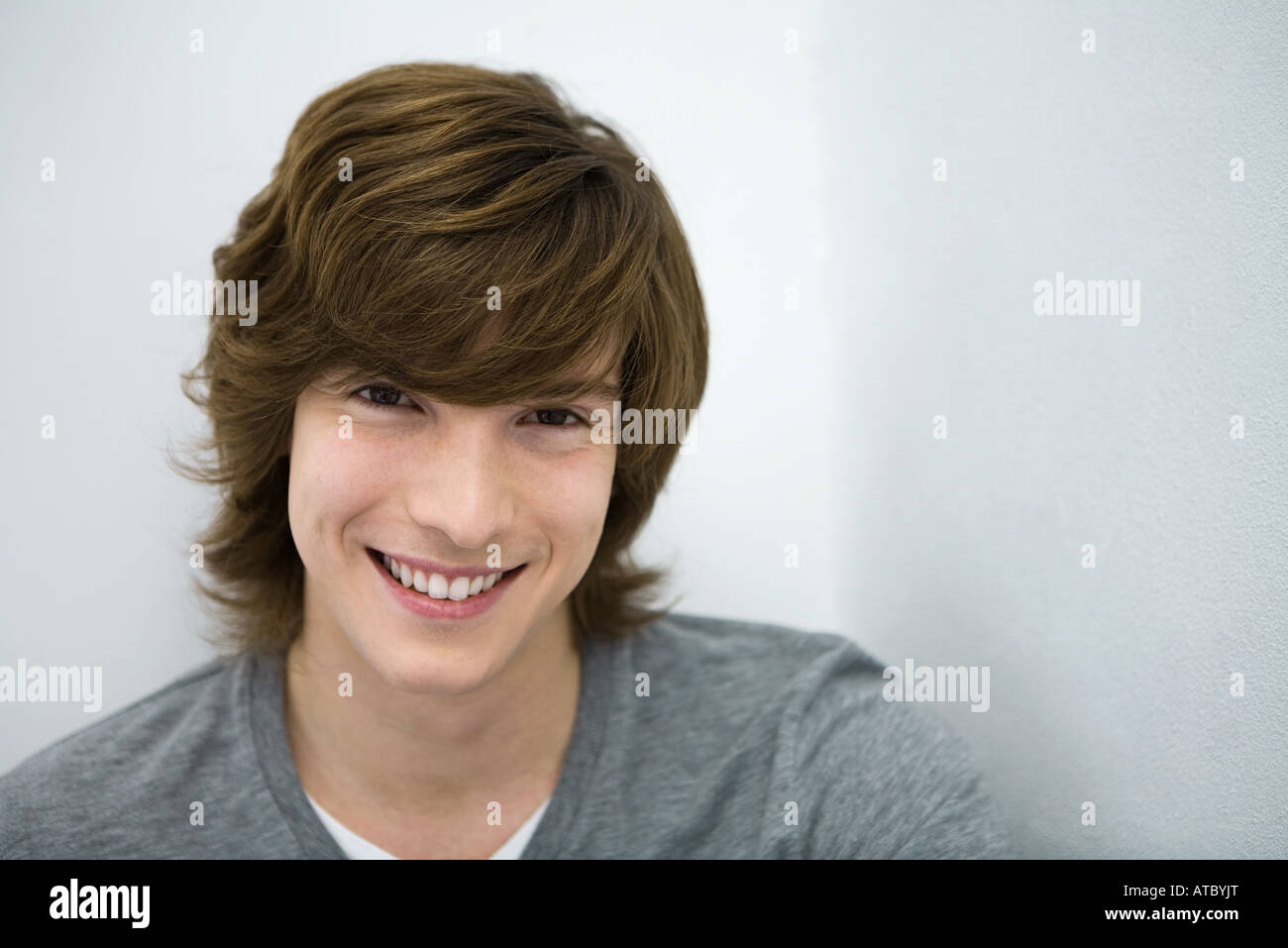 Young man smiling at camera, close-up, portrait Stock Photo