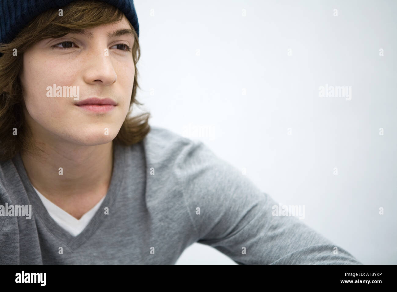Young man looking away, portrait, close-up Stock Photo