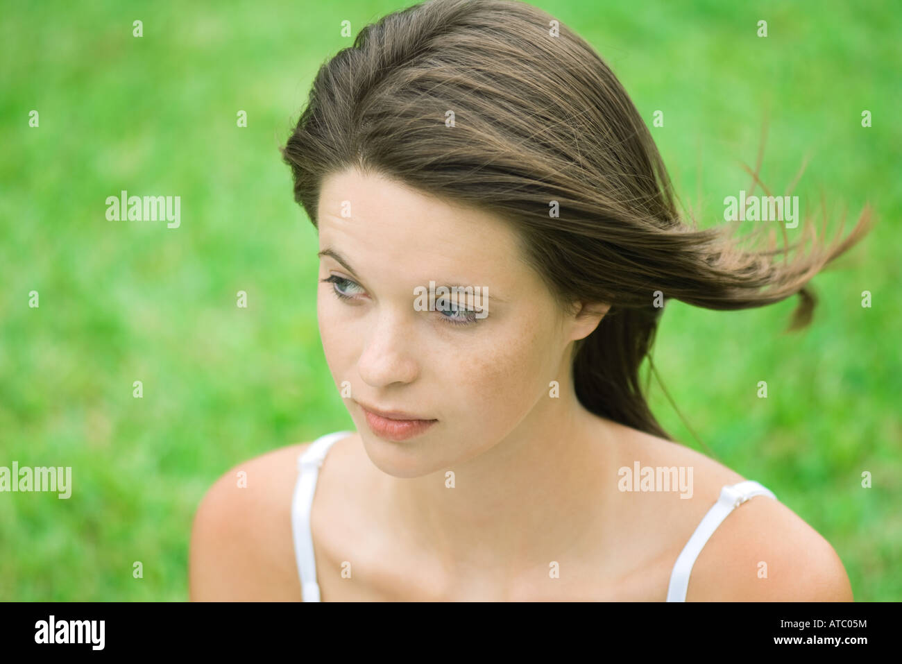 Teenage Girl Looking Away Hair Tousled By Wind High Angle View