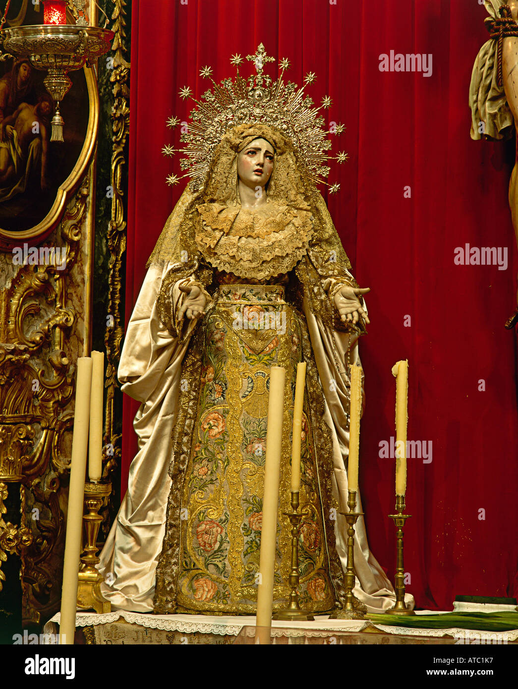 A gilded statue of the Virgin is rich in decorative detail inside the Inglesia de San Felipe Neri in Cadiz where the constitution which shaped the beginnings of Spain s liberty was instigated Stock Photo