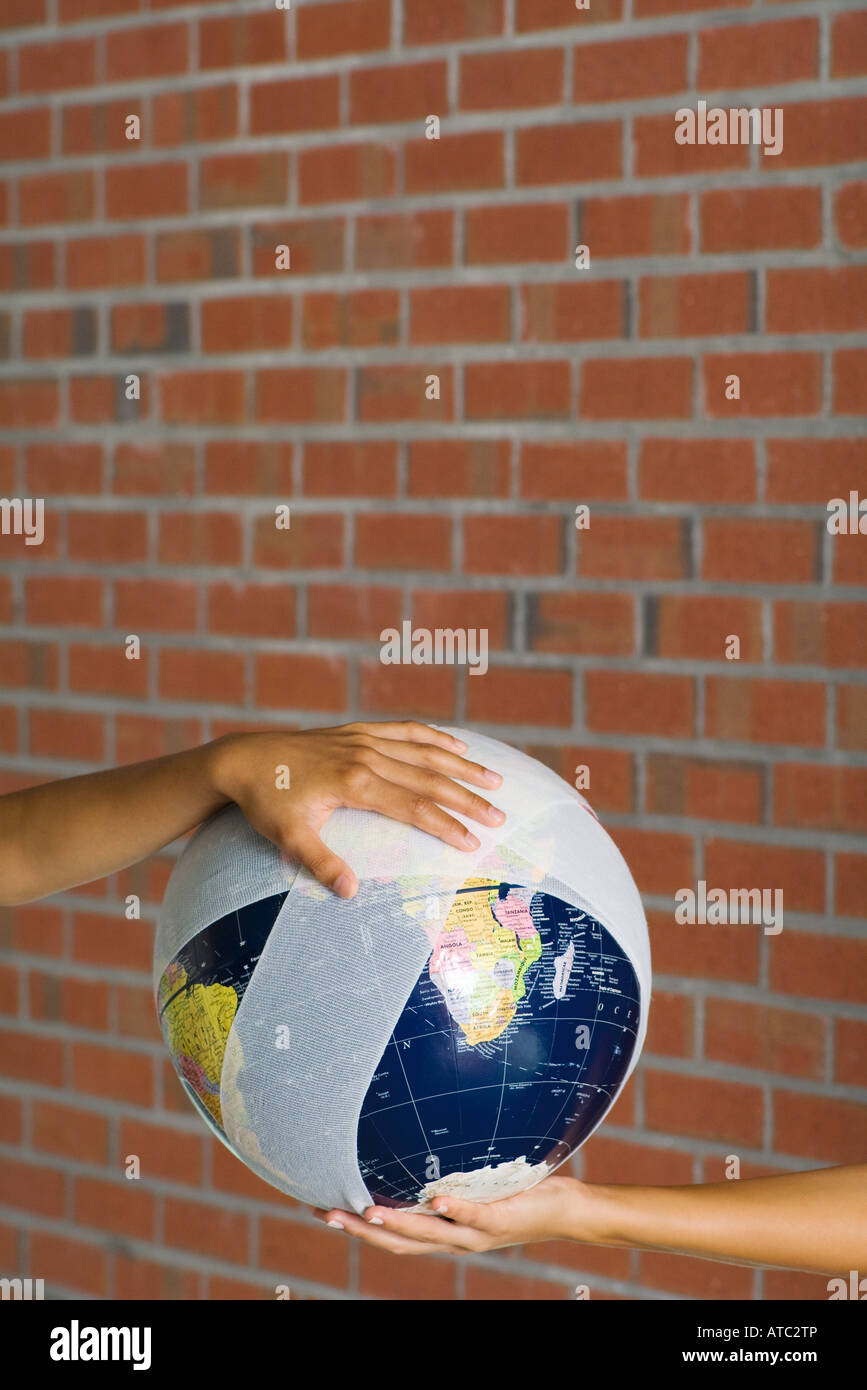 Holding globe in two hands hi-res stock photography and images - Alamy