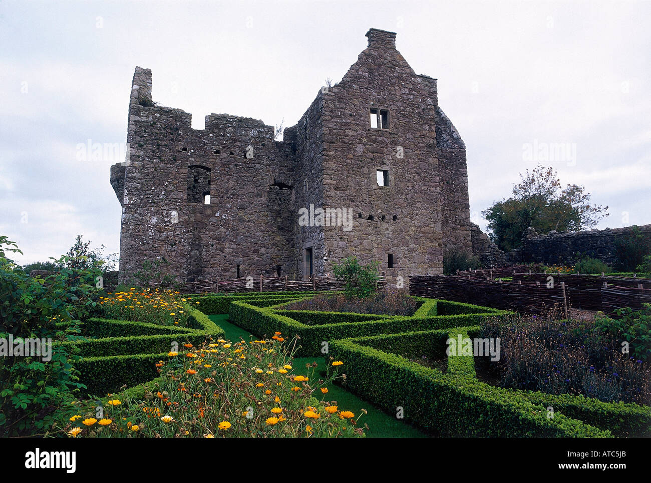 Tully Castle the extensive ruins of Scottish style stronghouse of the early 17th century set amidst a fine replica of a 17th century garden Derrygonnelly Stock Photo