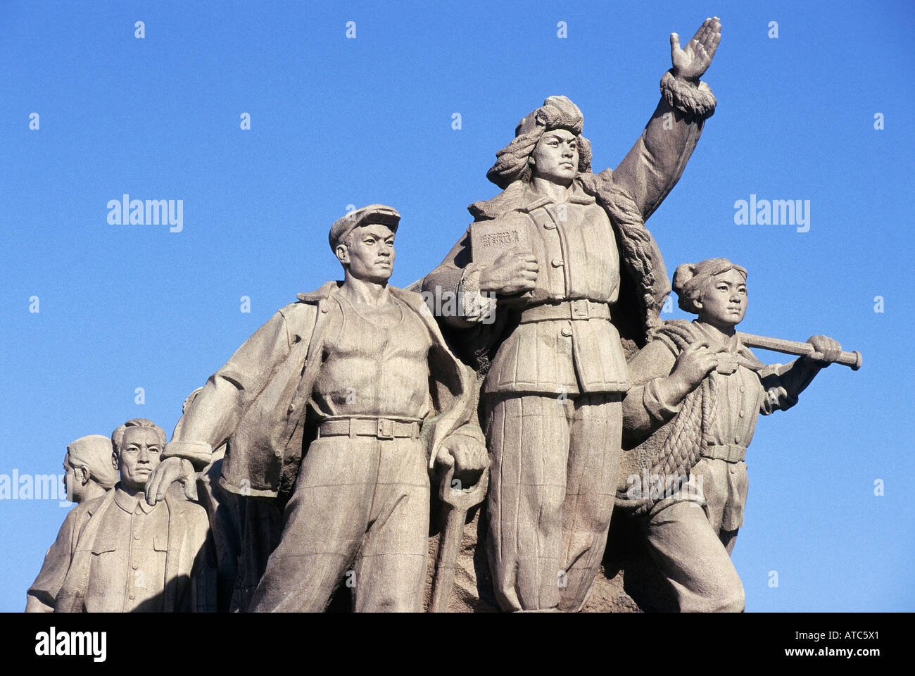 Detail of one of the sculpted groups executed in the style of Social Realism set in front of Mao s Mausoleum in front of Qianmen Qian Gate in Tiananmen Square Beijing Stock Photo