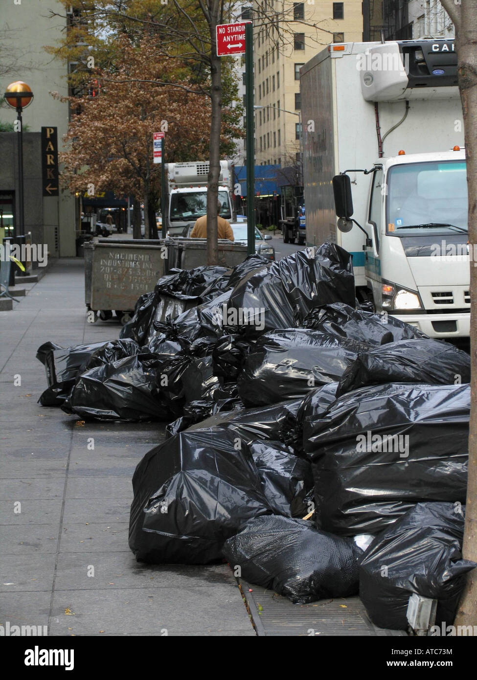 black garbage bags and containers on sidewalk, USA, Manhattan, New York Stock Photo