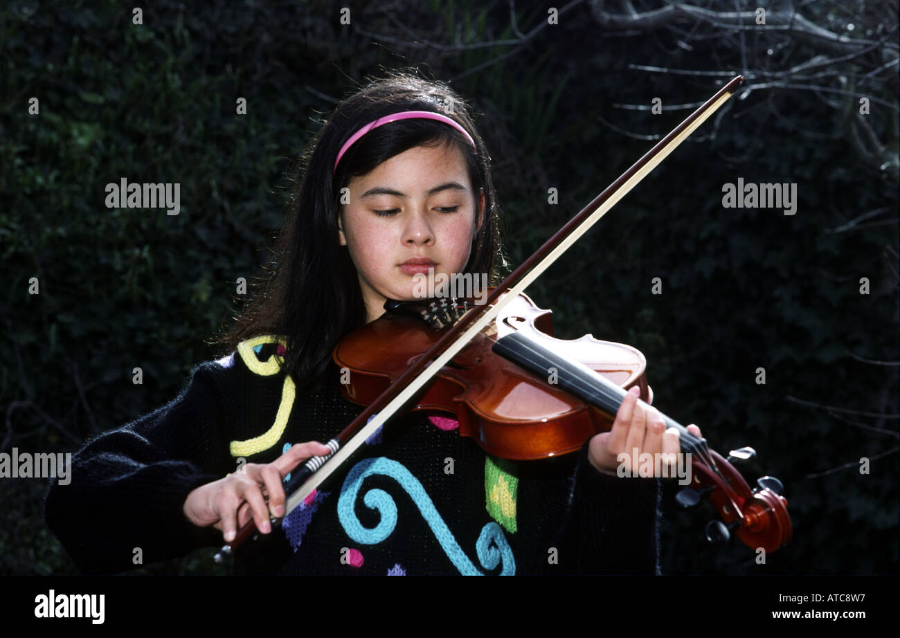 girl plays violin San Francisco California USA Stock Photo