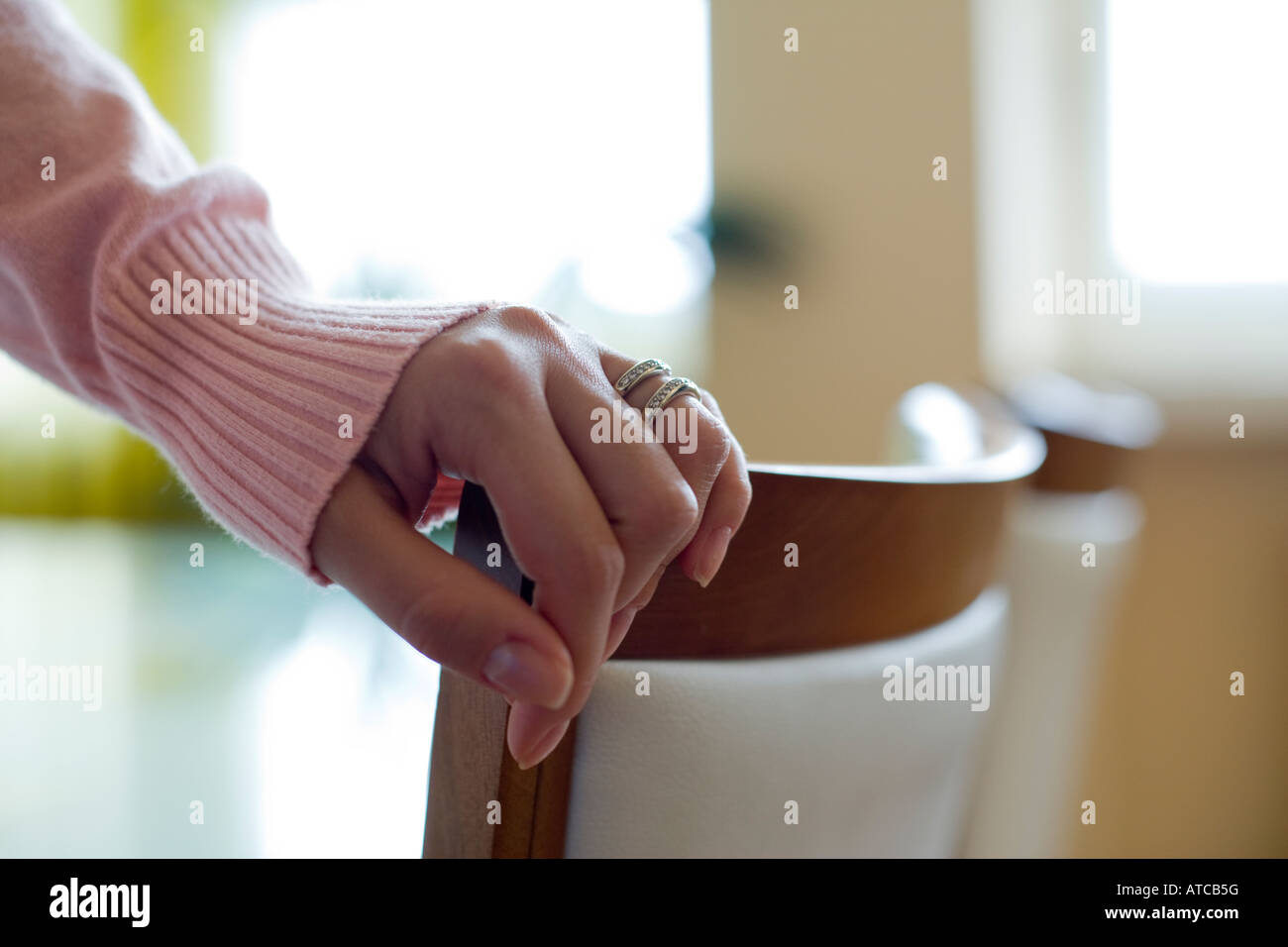 detail of a woman hand grabbing a chair Stock Photo Alamy