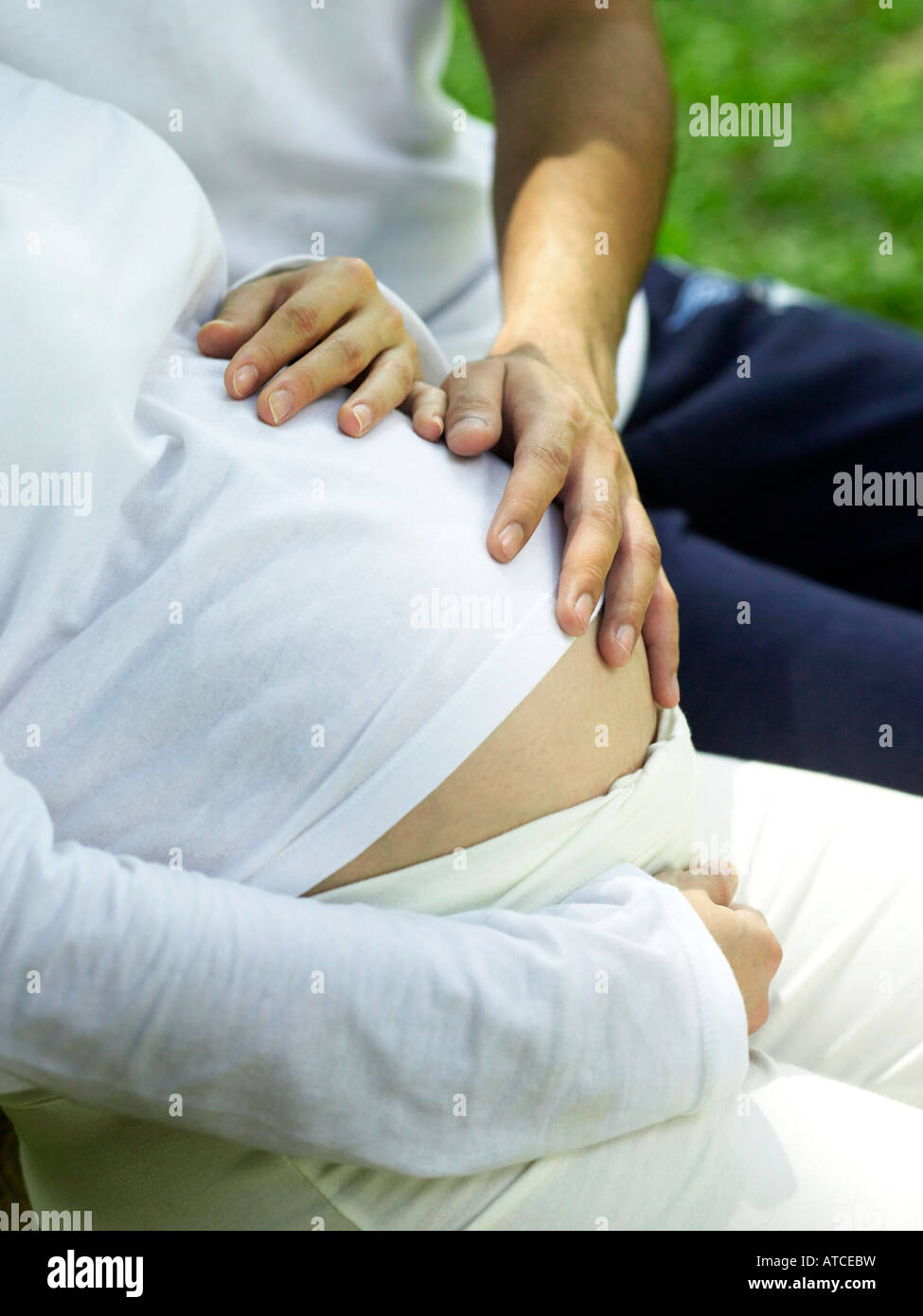 man and pregnant woman in the park Stock Photo - Alamy