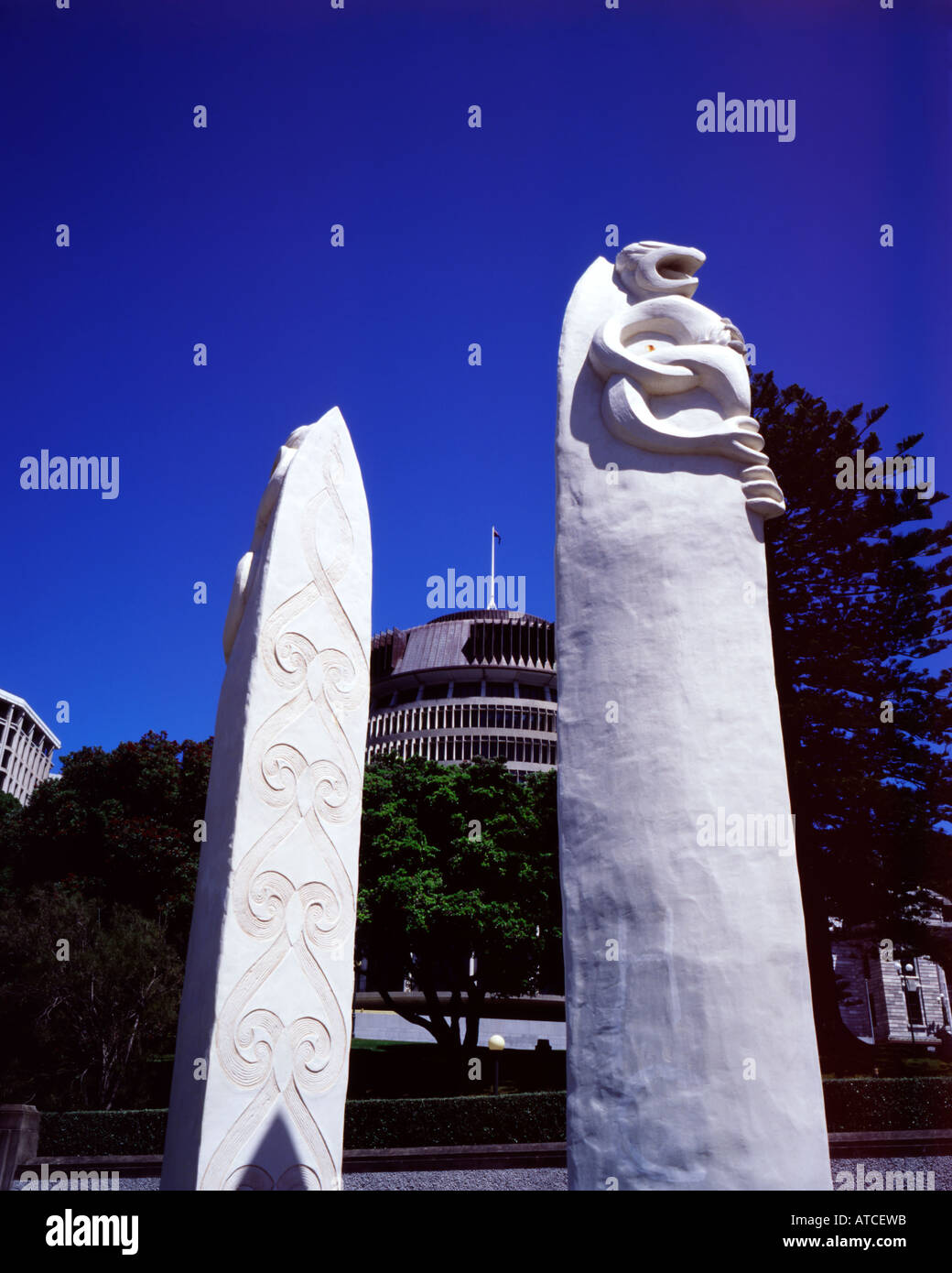 maori sculptures outside parliament beehive building in wellington new