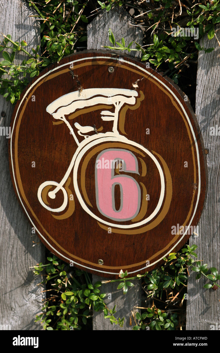 Number Six on a wooden fence Stock Photo