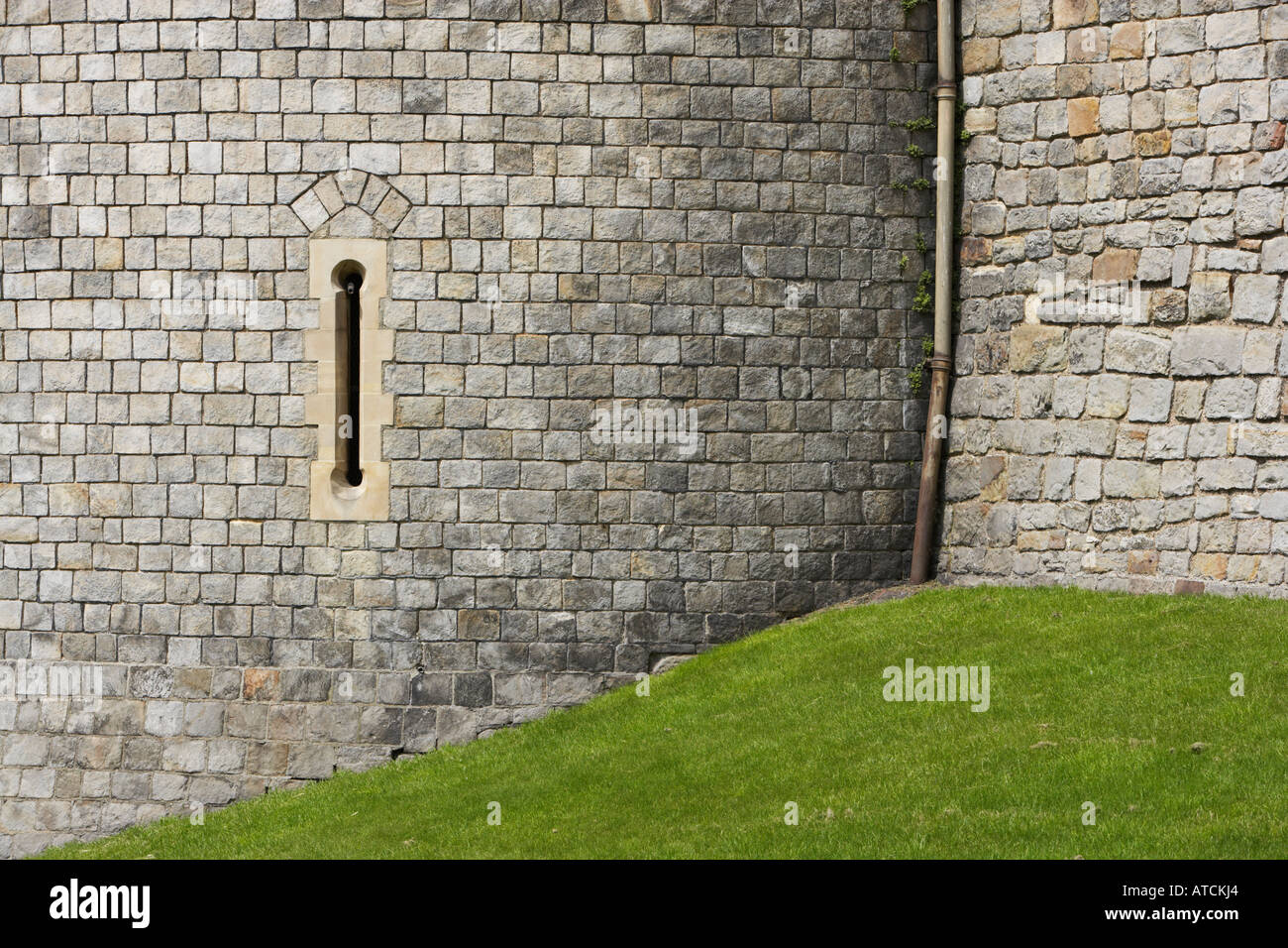 arrow slits in the walls of Windsor Castle Stock Photo