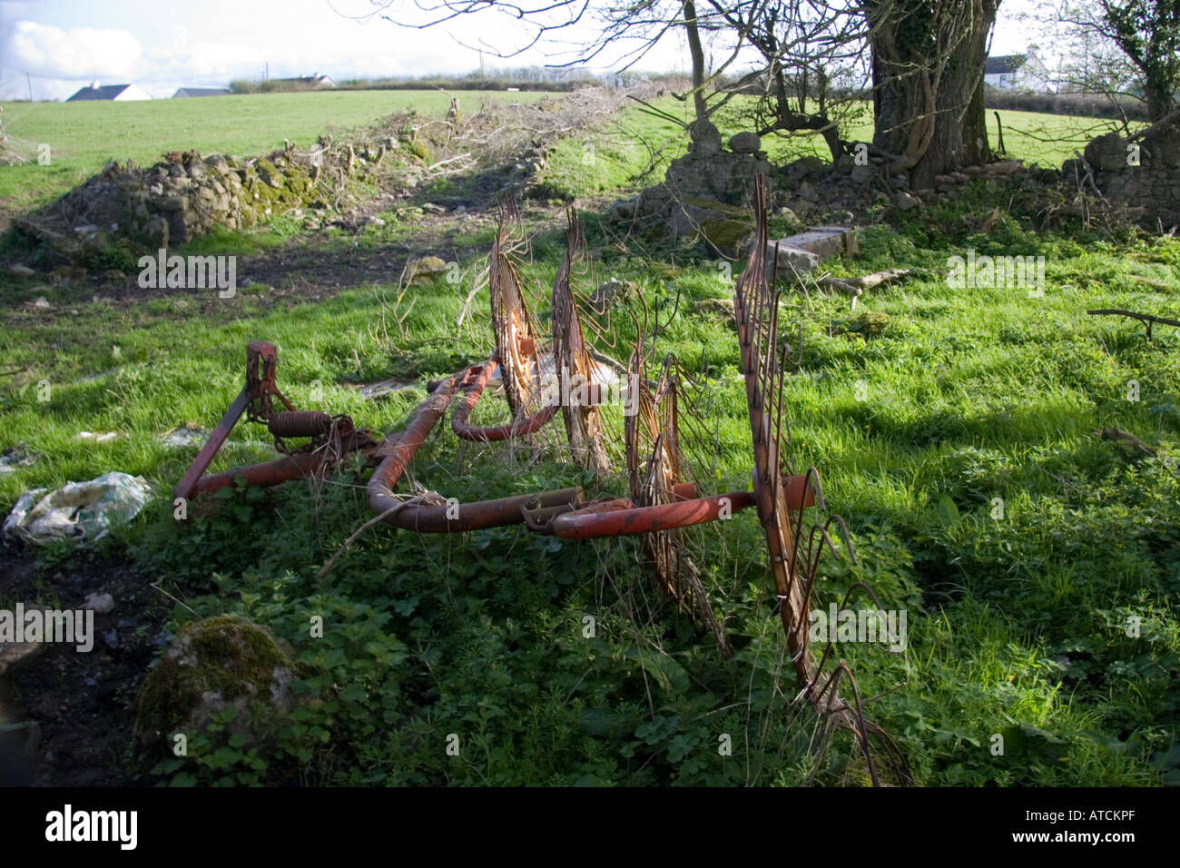 Abandoned Plough in Field Ireland Stock Photo