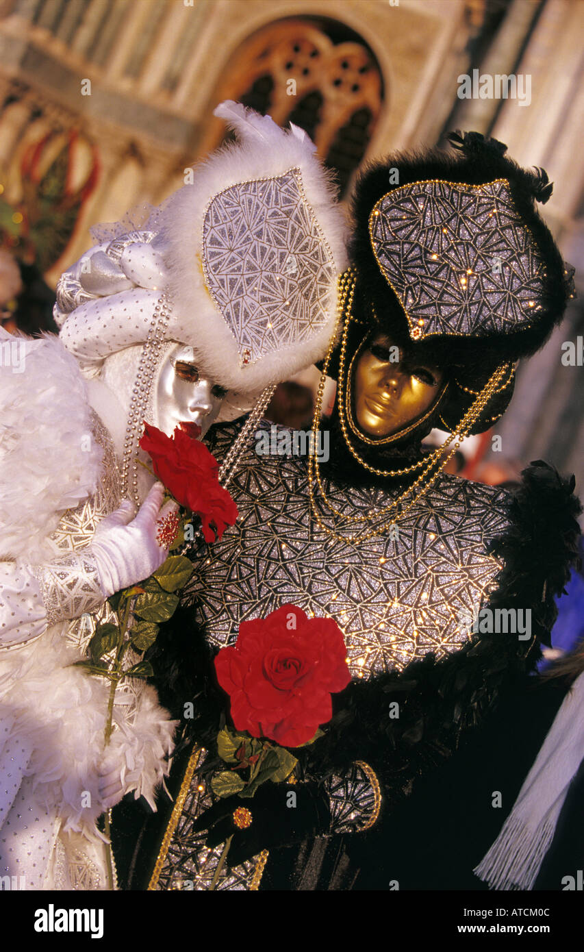 A couple of masqueraders wearing venetian masks in Carnival of Venice 2005 Stock Photo