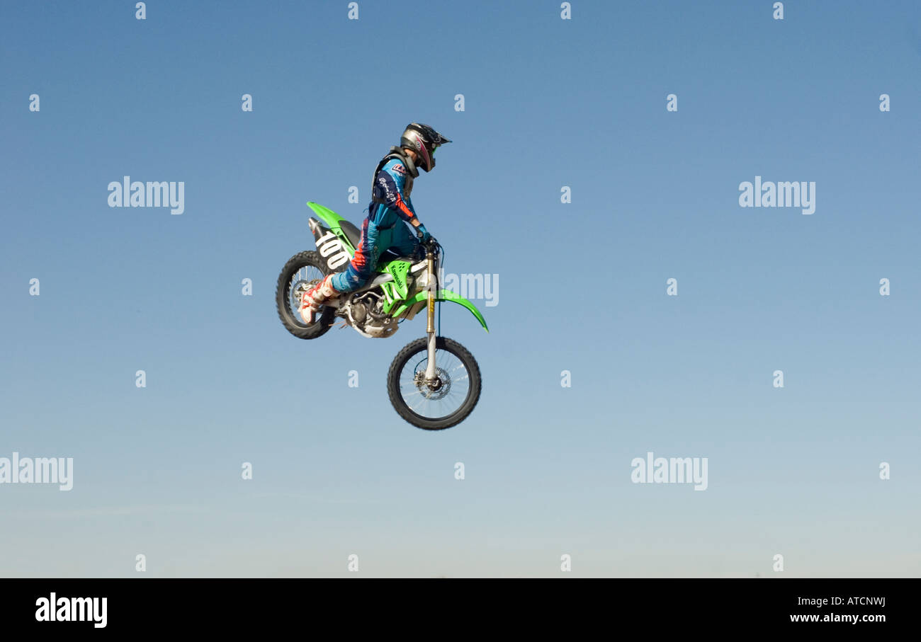 Dirt bike motorcycle rider jumping doing a trick called a whip Fourth ...