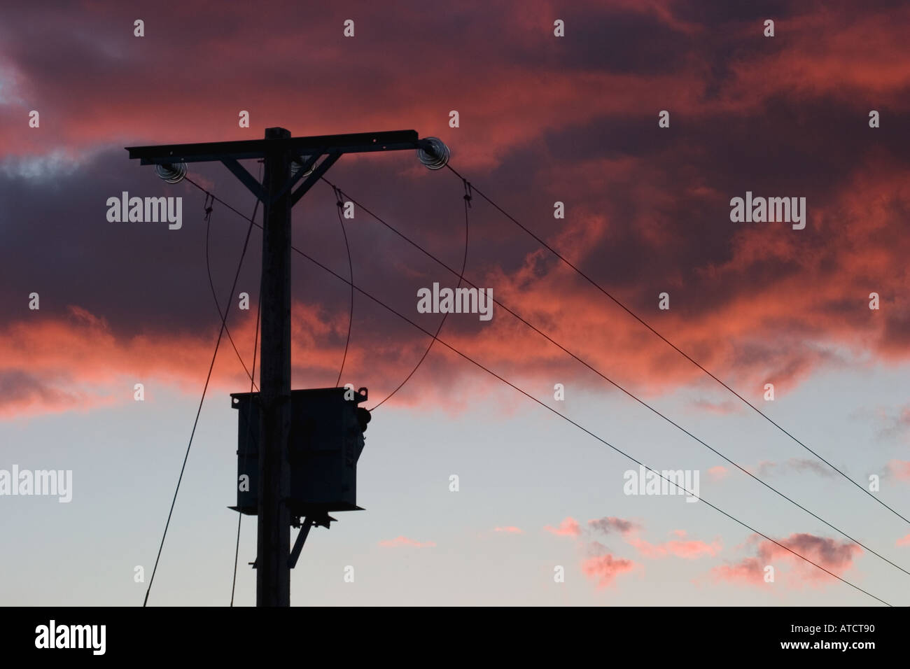 Electricity Power Lines against Sunset Sky Stock Photo - Alamy