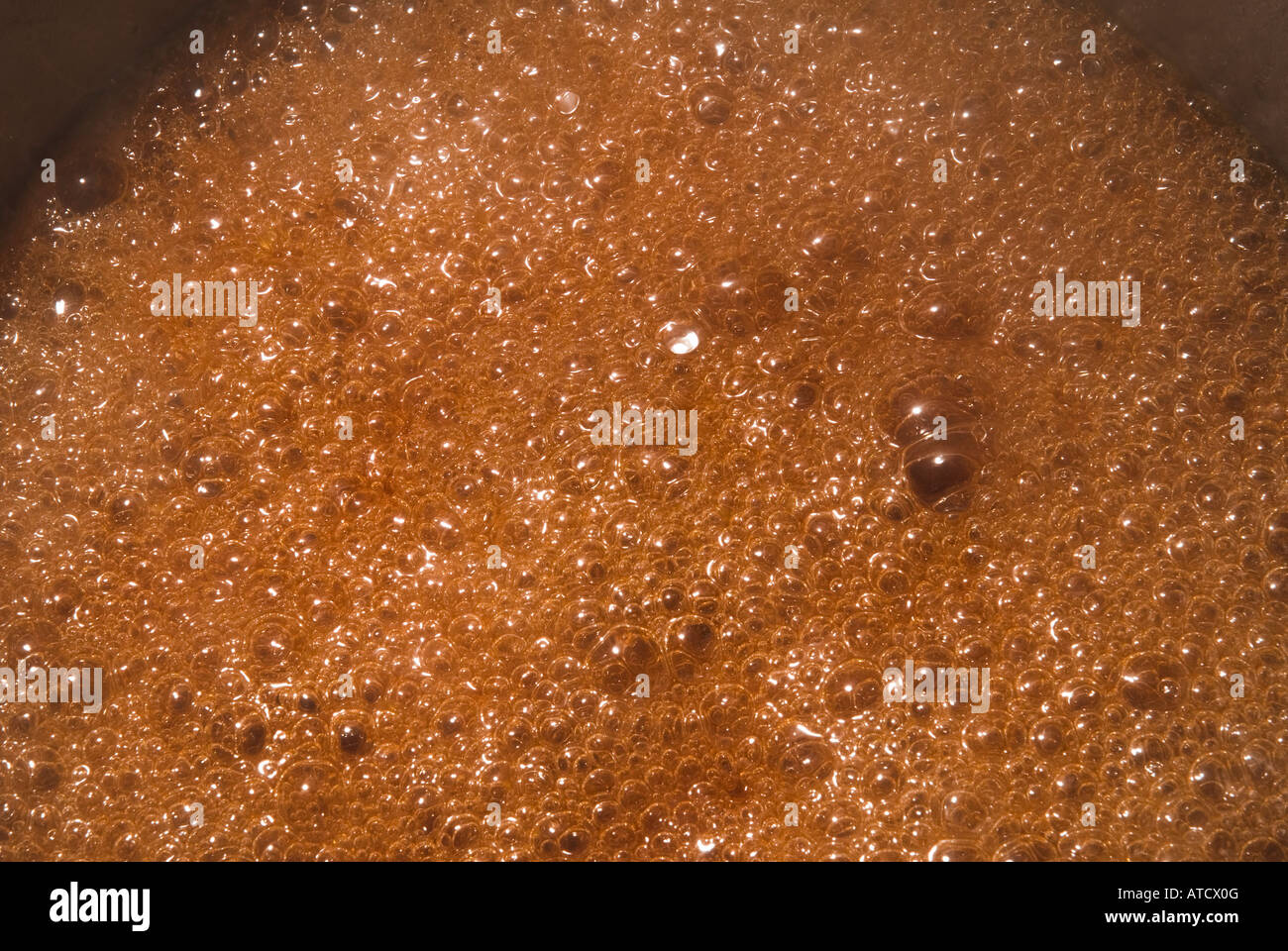 bubbling boiling cooking sugar syrup Stock Photo Alamy