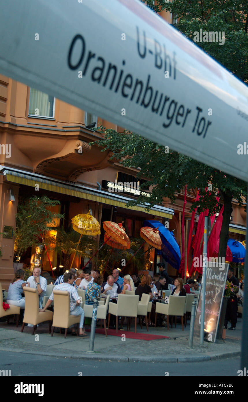 On a warm summer evening people are dining in an oriental open air restaurant on Oranienburger Strasse. Berlin, Mitte, 2005. Stock Photo