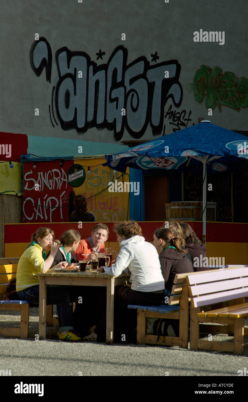Saturday afternoon on Oranienburger Strasse in Berlin Mitte: Group of teenage friends eating out in a small open air restaurant. Stock Photo
