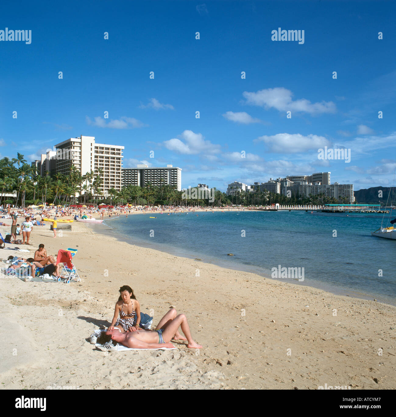 Sunbathing waikiki beach honolulu oahu hires stock photography and images Alamy