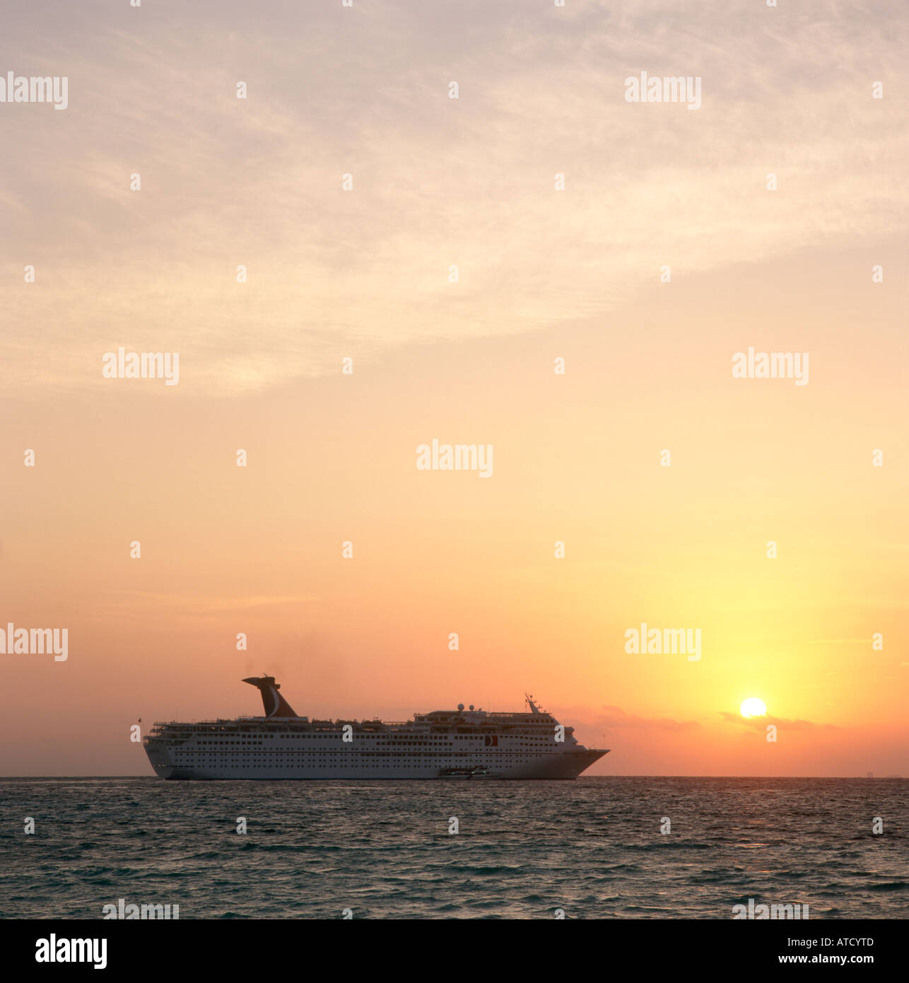 Cruise Ship off the coast of Cancun at Sunset, Quintana Roo, Yucatan Peninsula, Mexico Stock Photo