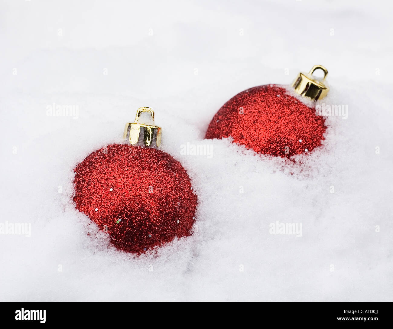 two christmas baubles in white snow Stock Photo