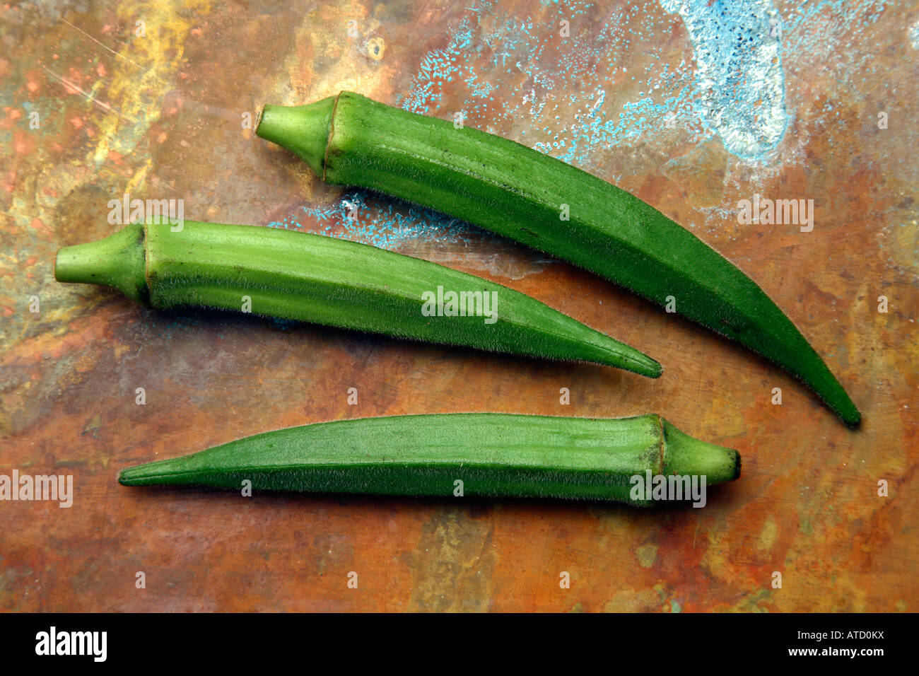 Okra on an rustic copper background. Stock Photo