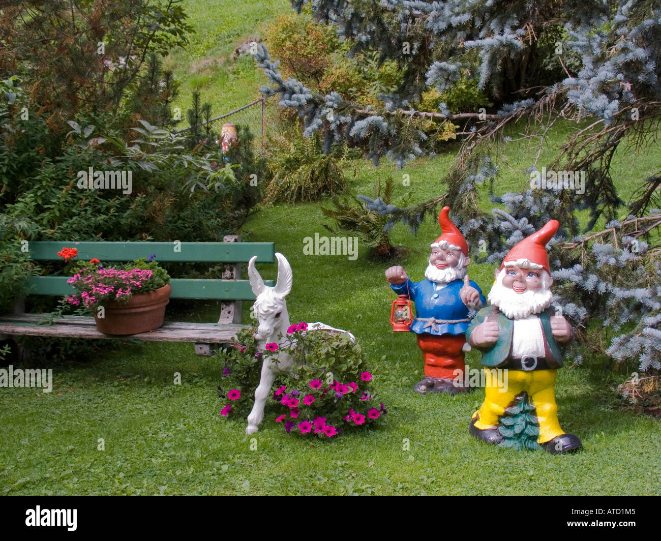 Garden gnomes and flowers in yard Gimmelwald Switzerland Stock Photo
