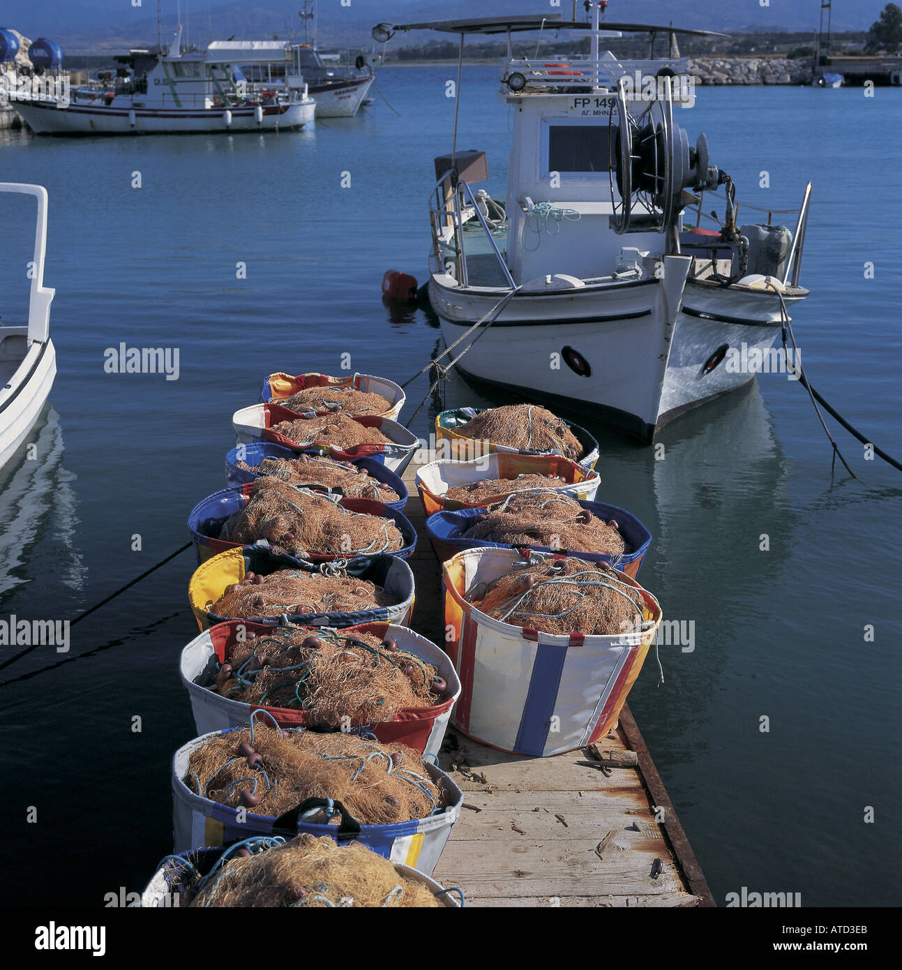 Fishing boats and fishing nets at Paphos port Stock Photo