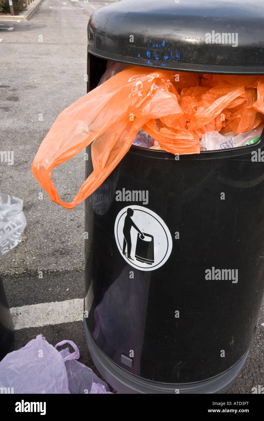 Orange plastic bag wast bin rubbish Stock Photo Alamy