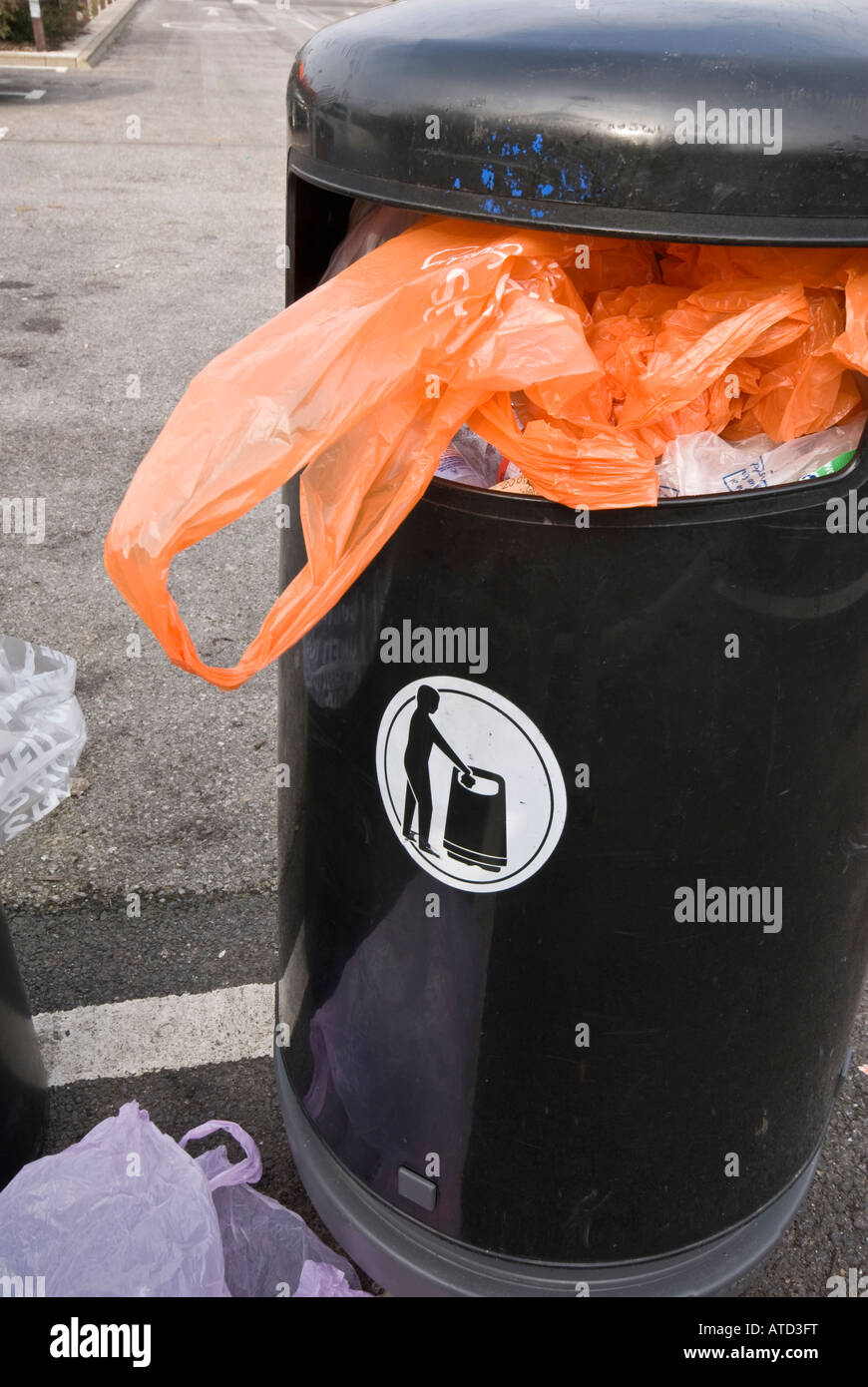 Orange plastic bag wast bin rubbish Stock Photo
