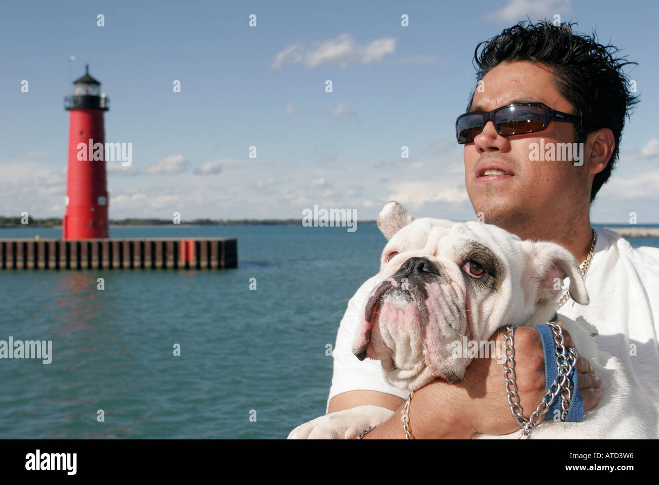 Wisconsin Kenosha County,Kenosha,Lake Michigan,Harbor Park,Pierhead Lighthouse,Hispanic man men male,bulldog,dog,pet,canine,animal,family families par Stock Photo
