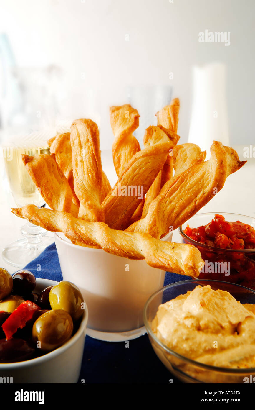 Cheese straws with humus dip and  in a party setting Stock Photo