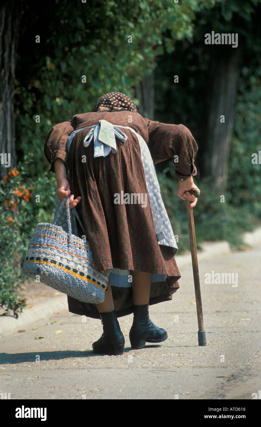 Old Woman Walking Stick Shopping High Resolution Stock Photography and