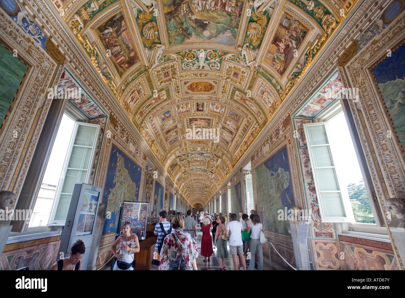People visiting the gallery of the maps vatican museums stock photo