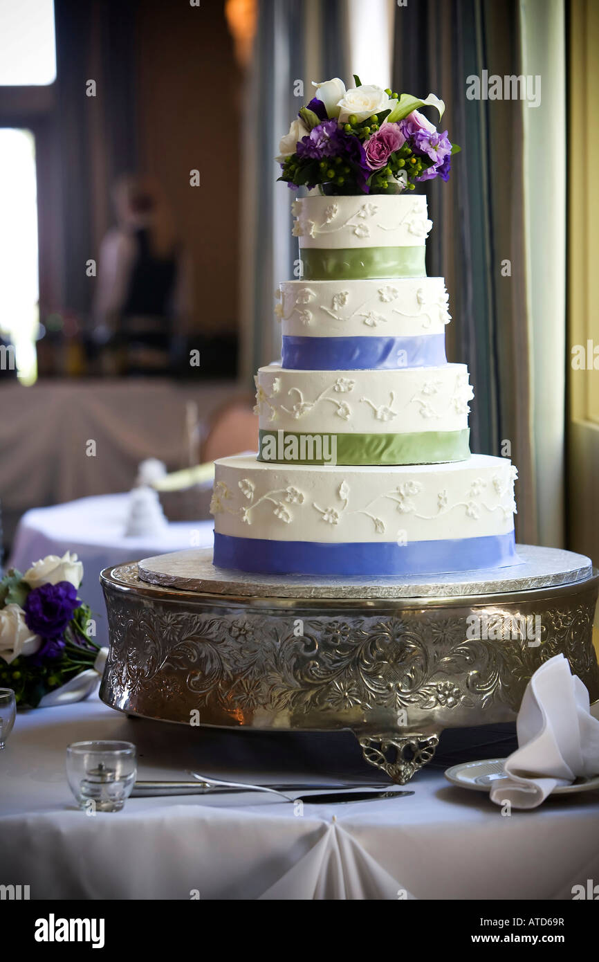 Wedding cake with flower topper Stock Photo - Alamy