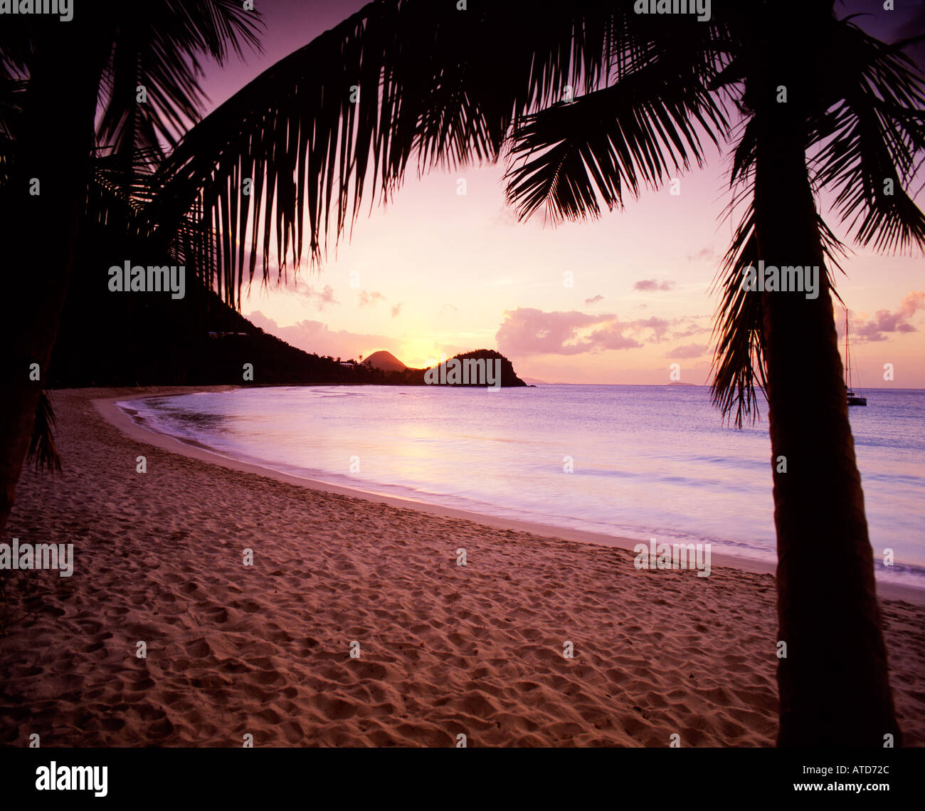 The sun sets over Smuggler's Beach in Tortola British Virgin Islands Stock Photo