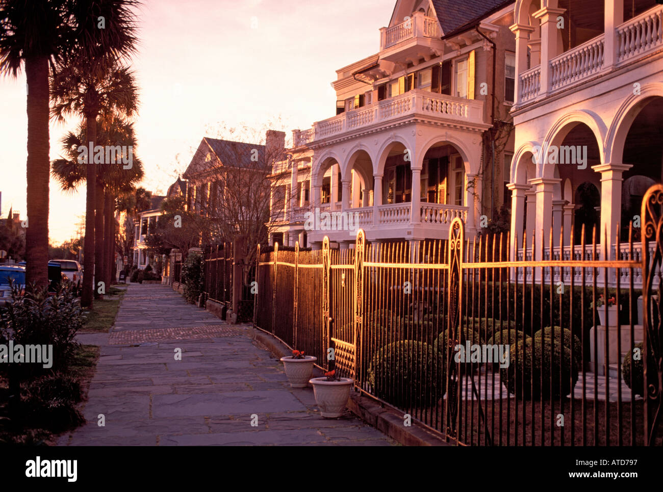 A sidewalk view of Charleston South Carolina as the sun begins to set Stock Photo