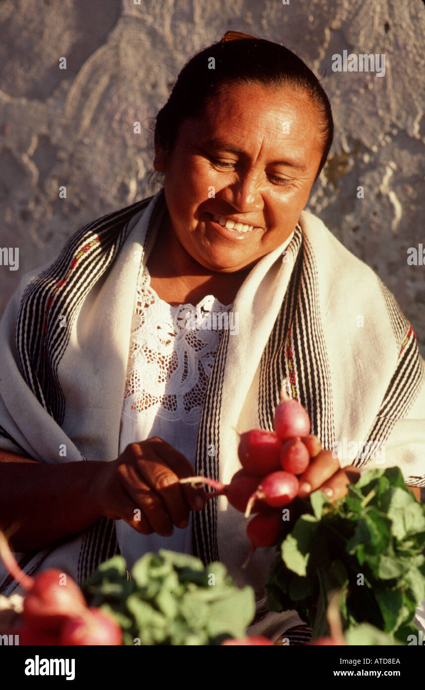 A woman tends to produce in Uxmal Mexico Stock Photo