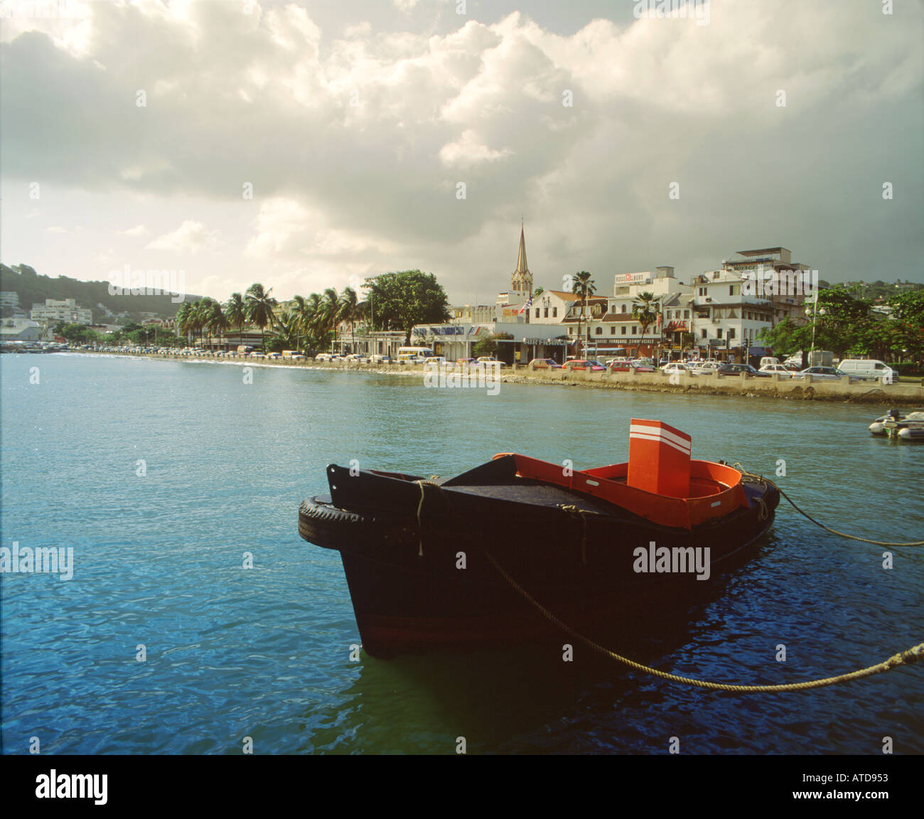 A fishing boat is moored off the coast of Case Pilote Martinique Stock Photo
