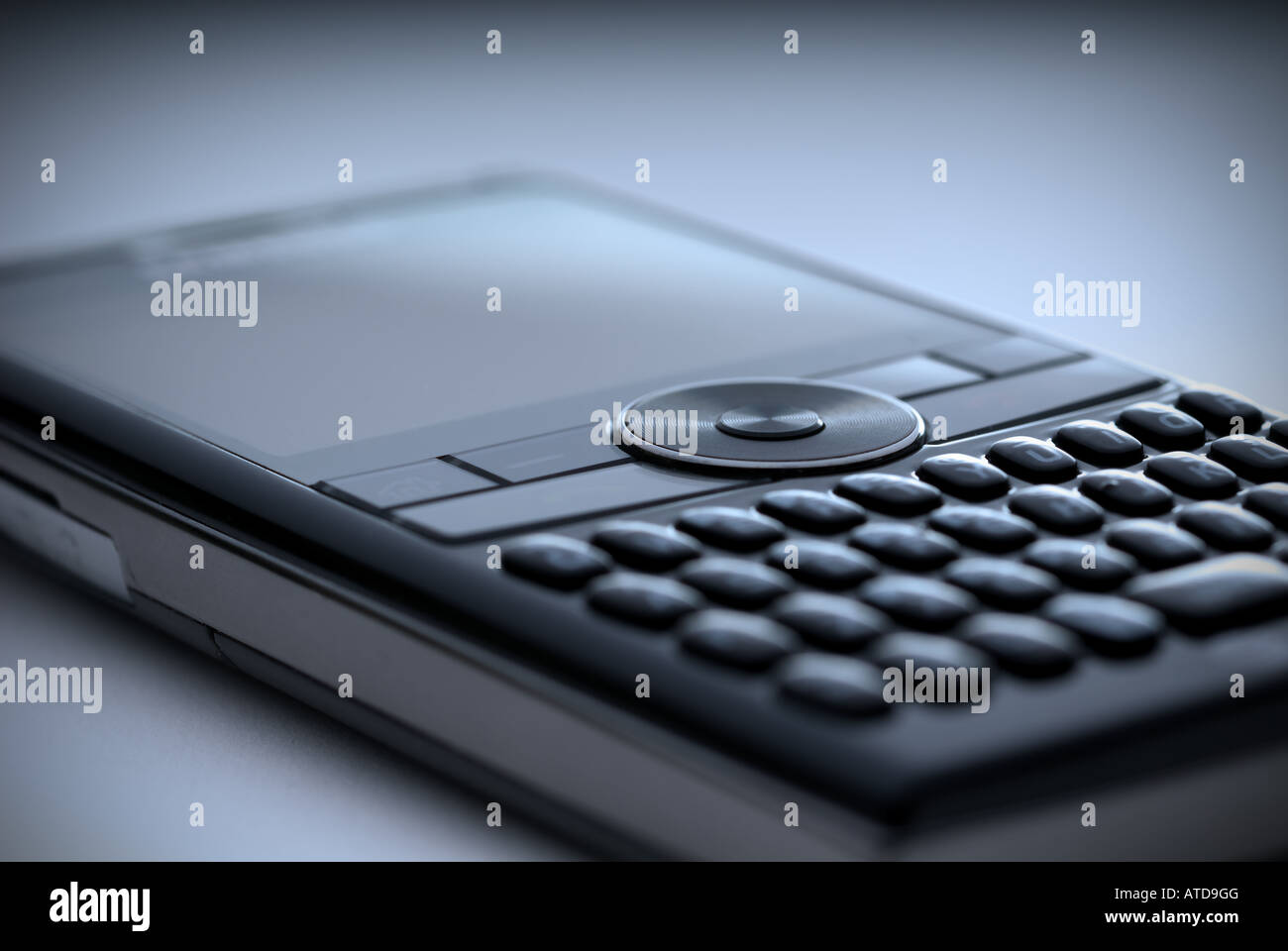 Shallow focus closeup of a high tech compact Smart Phone in a blue tint Stock Photo