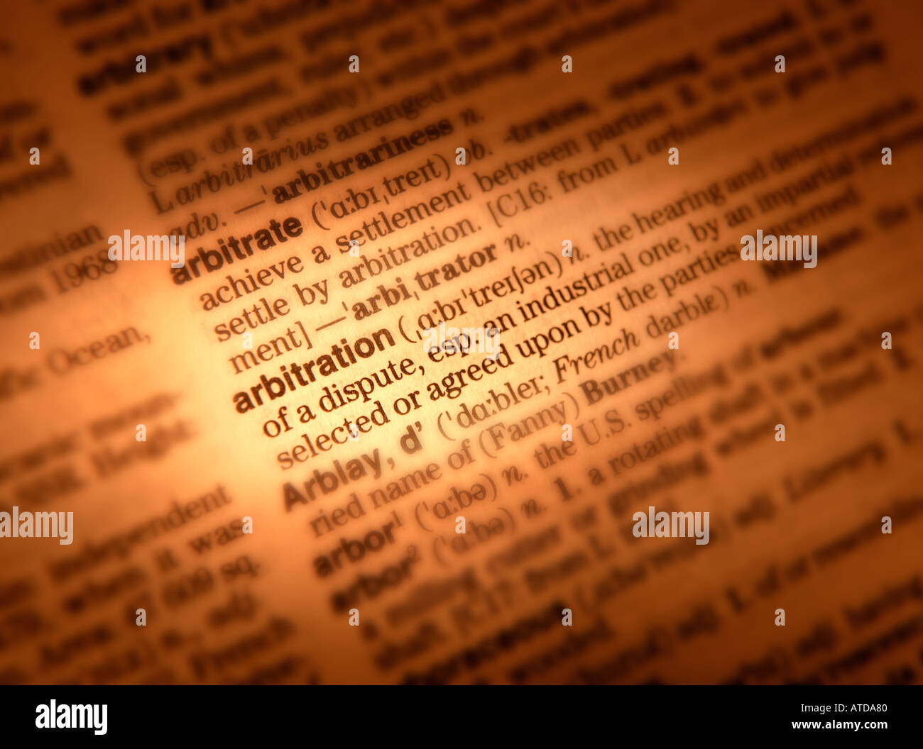 CLOSE UP OF DICTIONARY PAGE SHOWING DEFINITION OF THE WORD ARBITRATION Stock Photo