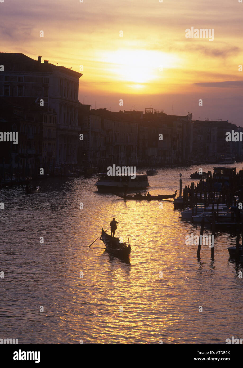 Gondola on Grand canal at sunset View from Rialto bridge Venice Veneto Italy Stock Photo