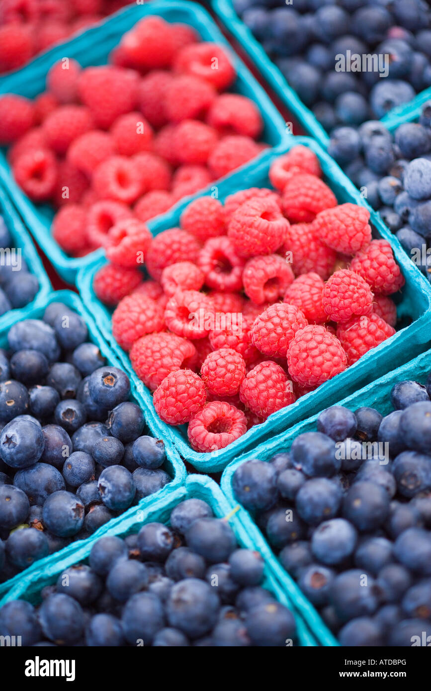 raspberries and blueberries are for sale at the Farmers Market Santa Barbara California Stock Photo