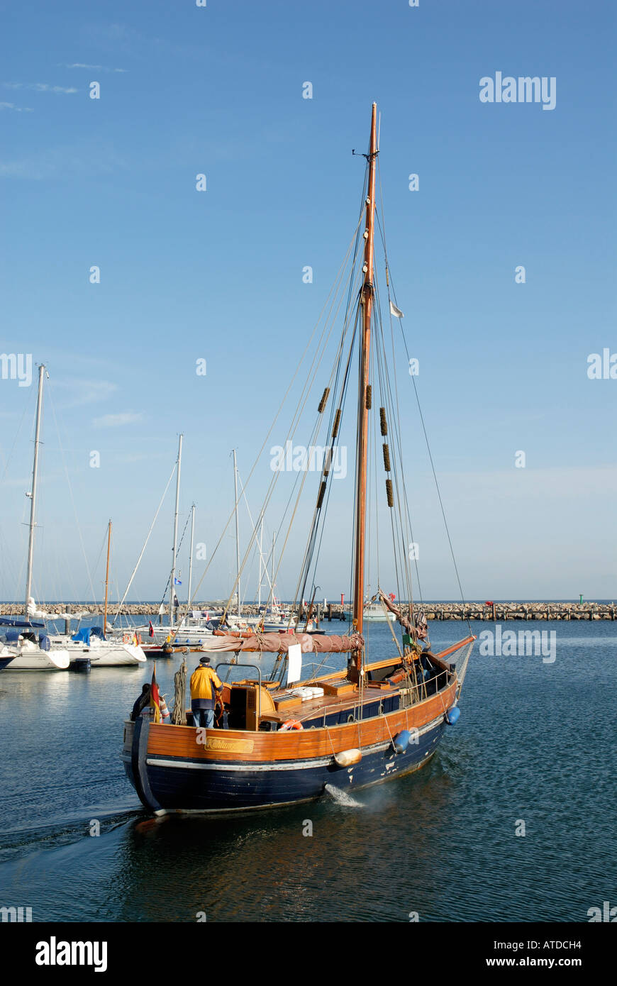 Historic fishing cutter leaves the marina at Kuehlungsborn, Mecklenburg-Vorpommern, Germany Stock Photo