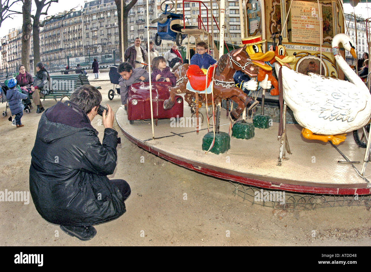 Dad Taking Pictures, Children Antique Merry go Round, Carousel, Paris