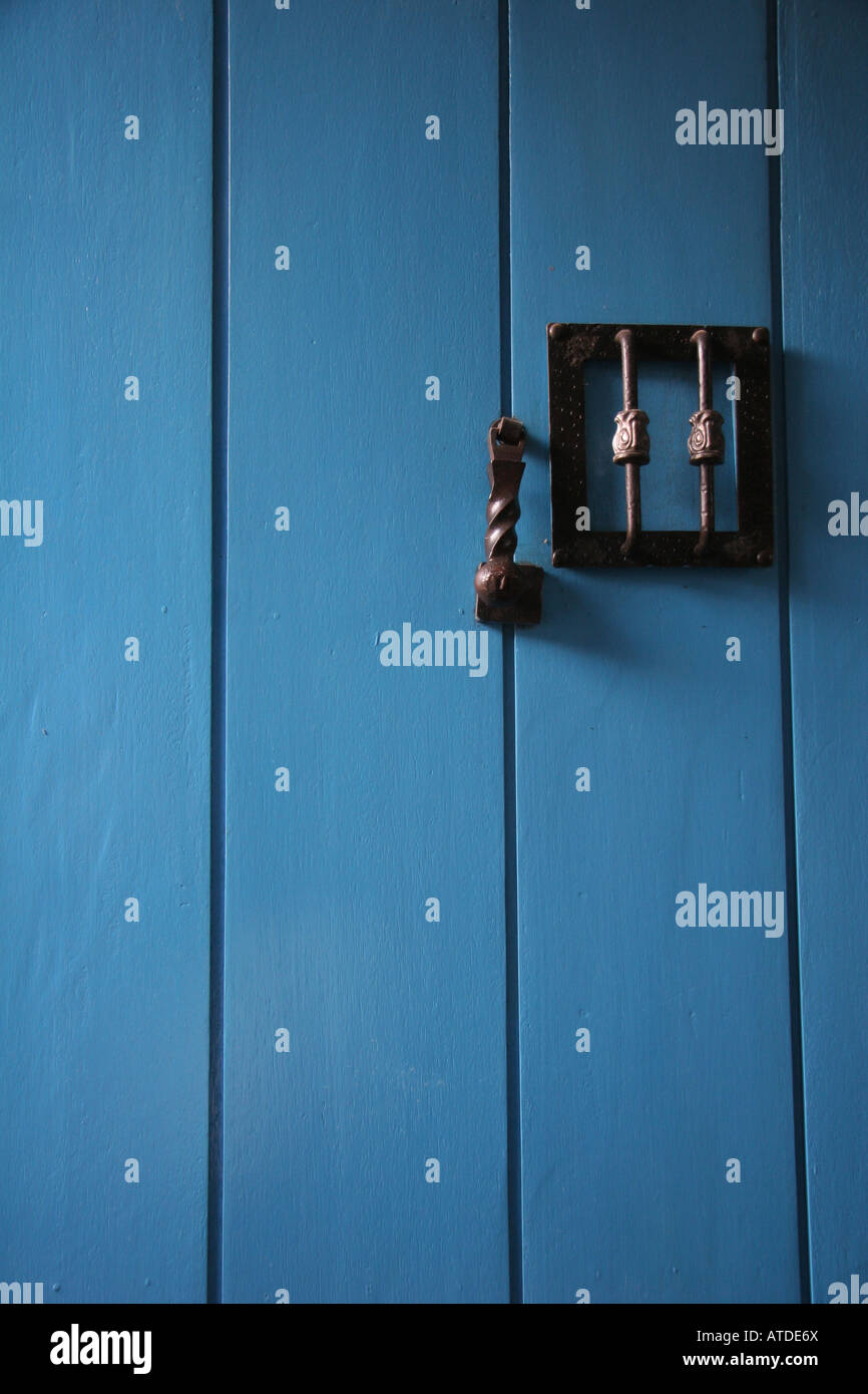 Brilliantly colored Blue door on side street in Cusco Peru Stock Photo