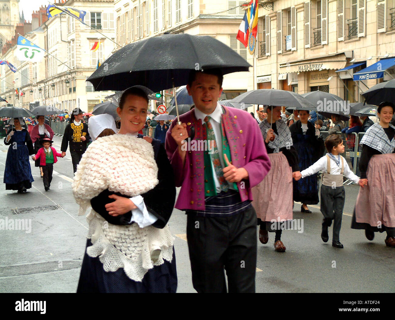 Family in regional costume during festival of Joan of Arc in Orleans